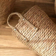 Load image into Gallery viewer, Hayden Tall Planters by Allthingscurated come in 3 sizes. Hand-woven using natural seagrass and comes with handles for easy transportation.