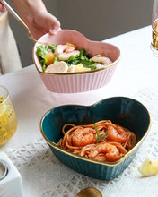 Load image into Gallery viewer, Teal heart-shaped blue bowls with spaghetti and shrimp on a table with another pink bowl of salad. Gold-rimmed Heart Shape Ceramic Bowl by Allthingscurated is a beautiful and versatile piece to own in your dinnerware collection. Perfect for salads, desserts and appetizers, its charming design adds an extra touch of romance for Valentine’s Day dinner; and make everyday meals extra special.