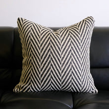 Load image into Gallery viewer, A black and white herringbone pattern cushion cover on a couch by Allthingscurated.