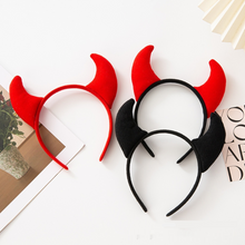 Load image into Gallery viewer, Horn Shape Headband by Allthingscurated features trendy, three-dimensional horns that is fun and perfect for elevating your Halloween party look. This accessory is perfect for adding a playful touch to your costume and make a statement at any Halloween party. Comes in 3 colors.
