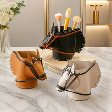 Load image into Gallery viewer, Three horse-shaped organizers in brown, black, and beige, styled on a marble surface with makeup brushes in the black one.