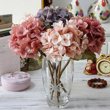 Load image into Gallery viewer, Silk Hydrangeas by Allthingscurated are made of premium quality silk that feature realistic looking flowers that are perfect for home décor and wedding venue decoration. Create a stunning display with 8 lovely colors available and add a touch of beauty and elegance to any space.