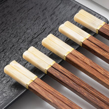 Load image into Gallery viewer, Faux Jade Wooden Chopsticks by Allthingscurated feature five striking colors with jade embellishment crafted from high-grade resin that is contemporary in design yet practical in everyday dining or special occasions. Come as a set of 5 pairs or 10 pairs. Shown here is a set in Ivory.