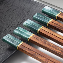 Load image into Gallery viewer, Faux Jade Wooden Chopsticks by Allthingscurated feature five striking colors with jade embellishment crafted from high-grade resin that is contemporary in design yet practical in everyday dining or special occasions. Come as a set of 5 pairs or 10 pairs. Shown here is a set in Jade Green.