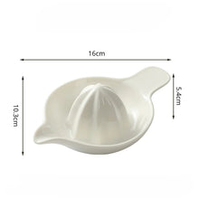 Load image into Gallery viewer, White ceramic citrus juicer with dimensions labeled on a white background. Ceramic Citrus Juicer by Allthingscurated features a classic reamer design with built-in pour spout that ensures precise pouring without spills. This single-piece tool is easy to store and indispensable in any bar or kitchen.