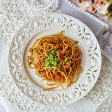 Load image into Gallery viewer, Juliette White Lace Dinnerware by Allthingscurated adds an elegant touch to your tabletop. This sophisticated set is crafted out of ceramic with a beautiful embossed lace rim, giving it a vintage touch. The creamy white pieces come in a dinner plate and cake stand in 2 sizes for easy mixing and matching. They are perfectly sized for a main course, starters and desserts.