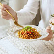 Load image into Gallery viewer, Juliette White Lace Dinnerware by Allthingscurated adds an elegant touch to your tabletop. This sophisticated set is crafted out of ceramic with a beautiful embossed lace rim, giving it a vintage touch. The creamy white pieces come in a dinner plate and cake stand in 2 sizes for easy mixing and matching. They are perfectly sized for a main course, starters and desserts.