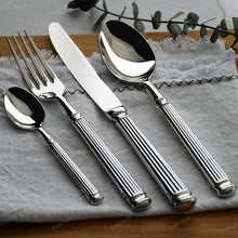Load image into Gallery viewer, Julius Silver Stainless Steel Flatware Sets by Allthingscurated are crafted from high-quality 18/10 stainless steel. The weighty and solid construction provides a luxurious feel, while the Roman column handle design adds a touch of elegance. The mirror polished surface reflects a bright and shiny finish, adding a touch of sophistication to any table.