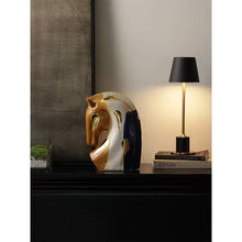 Load image into Gallery viewer, Decorative horse head sculpture and lamp on a shelf with a neutral background. Jyunma Ceramic Horse by Allthingscurated is handmade artistry at its finest. It’s more than just decoration, it embodies auspiciousness and prosperity; represents steadfast loyalty and protective guardianship through time. Its elegance makes it a perfect gift for any horse enthusiasts or anyone born under the Chinese zodiac sign of the horse; and an exquisite addition to any contemporary home for its enduring appeal.