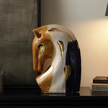 Load image into Gallery viewer, Decorative horse head sculpture on a shelf with a neutral background. Jyunma Ceramic Horse by Allthingscurated is handmade artistry at its finest. It’s more than just decoration, it embodies auspiciousness and prosperity; represents steadfast loyalty and protective guardianship through time. Its elegance makes it a perfect gift for any horse enthusiasts or anyone born under the Chinese zodiac sign of the horse; and an exquisite addition to any contemporary home for its enduring appeal.