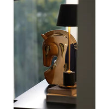 Load image into Gallery viewer, Decorative lamp with horse head design on a reflective surface. Jyunma Ceramic Horse by Allthingscurated is handmade artistry at its finest. It’s more than just decoration, it embodies auspiciousness and prosperity; represents steadfast loyalty and protective guardianship through time. Its elegance makes it a perfect gift for any horse enthusiasts or anyone born under the Chinese zodiac sign of the horse; and an exquisite addition to any contemporary home for its enduring appeal.