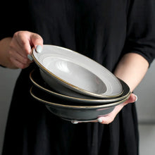 Load image into Gallery viewer, Kovan Ceramic Pasta/Soup Bowl by Allthingscurated is a stylish and functional bowl that offers versatility and practicality in usage. Perfectly sized for pasta, soups, stews, desserts and more. It’s a must-have addition to your dinnerware collection for all occasions from formal dining to everyday casual meals. Comes in gray and black.