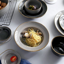 Load image into Gallery viewer, Kovan Ceramic Pasta/Soup Bowl by Allthingscurated is a stylish and functional bowl that offers versatility and practicality in usage. Perfectly sized for pasta, soups, stews, desserts and more. It’s a must-have addition to your dinnerware collection for all occasions from formal dining to everyday casual meals. Comes in gray and black.