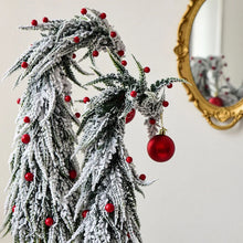 Load image into Gallery viewer, Snow Flocked Grinch Christmas Trees by Allthingscurated feature bending trees with a touch of quirkiness. The abstract design is both unconventional and whimsical. These snow-covered trees are decorated with crimson red baubles that will transform your home into a winter wonderland. Available in 2 sizes.