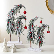Load image into Gallery viewer, Snow Flocked Grinch Christmas Trees by Allthingscurated feature bending trees with a touch of quirkiness. The abstract design is both unconventional and whimsical. These snow-covered trees are decorated with crimson red baubles that will transform your home into a winter wonderland. Available in 2 sizes.