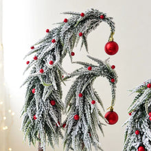 Load image into Gallery viewer, Snow Flocked Grinch Christmas Trees by Allthingscurated feature bending trees with a touch of quirkiness. The abstract design is both unconventional and whimsical. These snow-covered trees are decorated with crimson red baubles that will transform your home into a winter wonderland. Available in 2 sizes.