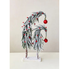 Load image into Gallery viewer, Snow Flocked Grinch Christmas Trees by Allthingscurated feature bending trees with a touch of quirkiness. The abstract design is both unconventional and whimsical. These snow-covered trees are decorated with crimson red baubles that will transform your home into a winter wonderland. Available in 2 sizes.