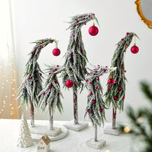 Load image into Gallery viewer, Snow Flocked Grinch Christmas Trees by Allthingscurated feature bending trees with a touch of quirkiness. The abstract design is both unconventional and whimsical. These snow-covered trees are decorated with crimson red baubles that will transform your home into a winter wonderland. Available in 2 sizes.