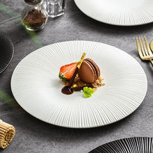 Load image into Gallery viewer, Line Textured Dinner Plates by Allthingscurated featured distinct bold lines that exude modernity and timelessness. Come in stylish black and white, they mix and match easily with your existing dinnerware and suitable for a wide range of occasions. Come in 2 sizes.