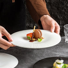 Load image into Gallery viewer, Line Textured Dinner Plates by Allthingscurated featured distinct bold lines that exude modernity and timelessness. Come in stylish black and white, they mix and match easily with your existing dinnerware and suitable for a wide range of occasions. Come in 2 sizes.