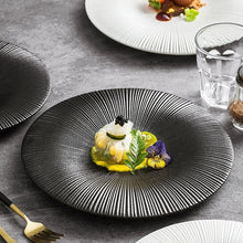 Load image into Gallery viewer, Line Textured Dinner Plates by Allthingscurated featured distinct bold lines that exude modernity and timelessness. Come in stylish black and white, they mix and match easily with your existing dinnerware and suitable for a wide range of occasions. Come in 2 sizes.