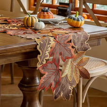 Load image into Gallery viewer, Autumn Maple Leaf Placemat and Table Runner by Allthingscurated featured detailed embroidery design of maple leaves in a beautiful spectrum of colors from light brown, to orangey and reddish hues. Perfect for creating a stunning autumnal table setting and adding a refined autumn touch to your living space and autumn-themed home décor.