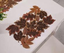 Load image into Gallery viewer, Autumn Maple Leaf Placemat and Table Runner by Allthingscurated featured detailed embroidery design of maple leaves in a beautiful spectrum of colors from light brown, to orangey and reddish hues. Perfect for creating a stunning autumnal table setting and adding a refined autumn touch to your living space and autumn-themed home décor.
