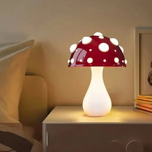 Load image into Gallery viewer, Whimsical Mushroom LED Lamp by Allthingscurated is unique and decorative, yet functional. The enchanting design features a playful mushroom silhouette, complete with red-capped spots lampshade to bring a touch of whimsy to any room. It makes a perfect gift for someone with a special affinity for mushrooms. Comes in a cordless and corded version with 2 lamp base colors.
