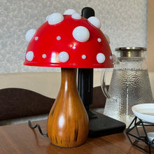 Load image into Gallery viewer, Whimsical Mushroom LED Lamp by Allthingscurated is unique and decorative, yet functional. The enchanting design features a playful mushroom silhouette, complete with red-capped spots lampshade to bring a touch of whimsy to any room. It makes a perfect gift for someone with a special affinity for mushrooms. Comes in a cordless and corded version with 2 lamp base colors.