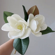 Load image into Gallery viewer, Faux Large White Magnolia by Allthingscurated is expertly crafted with realistic details to look as good as the real thing. It’s a gorgeous addition to your home décor and stays beautiful and pretty all year round. Its grand size makes it perfect as a single flower but creates a dramatic effect when arranged in a bunch. Measures 40cm or 15.6 inches in height and 18cm or 7 inches in width.