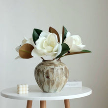 Load image into Gallery viewer, Faux Large White Magnolia by Allthingscurated is expertly crafted with realistic details to look as good as the real thing. It’s a gorgeous addition to your home décor and stays beautiful and pretty all year round. Its grand size makes it perfect as a single flower but creates a dramatic effect when arranged in a bunch. Measures 40cm or 15.6 inches in height and 18cm or 7 inches in width.