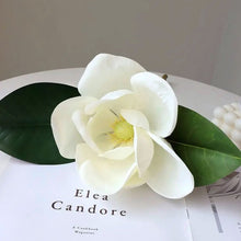 Load image into Gallery viewer, Faux Large White Magnolia by Allthingscurated is expertly crafted with realistic details to look as good as the real thing. It’s a gorgeous addition to your home décor and stays beautiful and pretty all year round. Its grand size makes it perfect as a single flower but creates a dramatic effect when arranged in a bunch. Measures 40cm or 15.6 inches in height and 18cm or 7 inches in width.