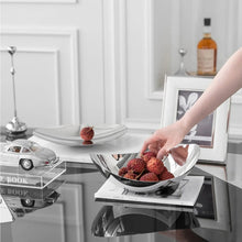 Load image into Gallery viewer, Manhattan Stainless Steel Fruit Bowl by Allthingscurated exudes elegance and modern sophistication. Crafted from high-quality stainless steel and featuring sleek, sexy curve lines with a beautiful mirror polish. Use it to beautifully present your fruits when hosting or give it as a perfect house warming gift. It’s the ultimate statement piece for contemporary homes and stylish décor. Comes in 3 sizes and nests for space-saving storage.
