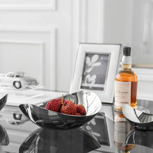 Load image into Gallery viewer, Manhattan Stainless Steel Fruit Bowl by Allthingscurated exudes elegance and modern sophistication. Crafted from high-quality stainless steel and featuring sleek, sexy curve lines with a beautiful mirror polish. Use it to beautifully present your fruits when hosting or give it as a perfect house warming gift. It’s the ultimate statement piece for contemporary homes and stylish décor. Comes in 3 sizes and nests for space-saving storage.