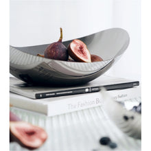 Load image into Gallery viewer, Manhattan Stainless Steel Fruit Bowl by Allthingscurated exudes elegance and modern sophistication. Crafted from high-quality stainless steel and featuring sleek, sexy curve lines with a beautiful mirror polish. Use it to beautifully present your fruits when hosting or give it as a perfect house warming gift. It’s the ultimate statement piece for contemporary homes and stylish décor. Comes in 3 sizes and nests for space-saving storage.