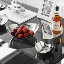 Load image into Gallery viewer, Manhattan Stainless Steel Fruit Bowl by Allthingscurated exudes elegance and modern sophistication. Crafted from high-quality stainless steel and featuring sleek, sexy curve lines with a beautiful mirror polish. Use it to beautifully present your fruits when hosting or give it as a perfect house warming gift. It’s the ultimate statement piece for contemporary homes and stylish décor. Comes in 3 sizes and nests for space-saving storage.