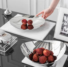 Load image into Gallery viewer, Manhattan Stainless Steel Fruit Bowl by Allthingscurated exudes elegance and modern sophistication. Crafted from high-quality stainless steel and featuring sleek, sexy curve lines with a beautiful mirror polish. Use it to beautifully present your fruits when hosting or give it as a perfect house warming gift. It’s the ultimate statement piece for contemporary homes and stylish décor. Comes in 3 sizes and nests for space-saving storage.