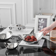 Load image into Gallery viewer, Manhattan Stainless Steel Fruit Bowl by Allthingscurated exudes elegance and modern sophistication. Crafted from high-quality stainless steel and featuring sleek, sexy curve lines with a beautiful mirror polish. Use it to beautifully present your fruits when hosting or give it as a perfect house warming gift. It’s the ultimate statement piece for contemporary homes and stylish décor. Comes in 3 sizes and nests for space-saving storage.