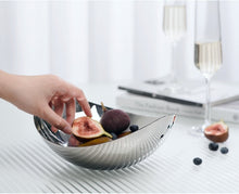 Load image into Gallery viewer, Manhattan Stainless Steel Fruit Bowl by Allthingscurated exudes elegance and modern sophistication. Crafted from high-quality stainless steel and featuring sleek, sexy curve lines with a beautiful mirror polish. Use it to beautifully present your fruits when hosting or give it as a perfect house warming gift. It’s the ultimate statement piece for contemporary homes and stylish décor. Comes in 3 sizes and nests for space-saving storage.