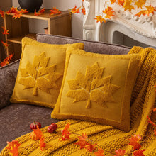 Load image into Gallery viewer, Yellow pillows with maple leaf patterns on a couch, surrounded by autumn decorations. The Velour Maple Leaf Cushion Cover by Allthingscurated is a beautiful way to bring the warmth of fall into your home. With its elegant tufted pumpkin design and soft velour fabric, it offers both comfort and style. Perfect for autumn and Thanksgiving, this decorative pillow adds a cozy, inviting touch to any space.