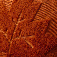 Load image into Gallery viewer, Close-up of a textured caramel color fabric with maple leaf pattern. The Velour Maple Leaf Cushion Cover by Allthingscurated is a beautiful way to bring the warmth of fall into your home. With its elegant tufted pumpkin design and soft velour fabric, it offers both comfort and style. Perfect for autumn and Thanksgiving, this decorative pillow adds a cozy, inviting touch to any space.