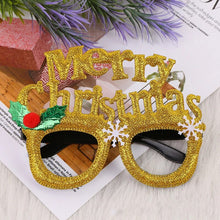 Load image into Gallery viewer, These Christmas Party Glasses by Allthingscurated are the perfect fun accessory for festive parties and gatherings during the holiday season. Their unique design and cheerful holiday style make them great props for creating memorable moments an happy Instagram posts to capture the joy of the season. Featured here is Merry Gold design.