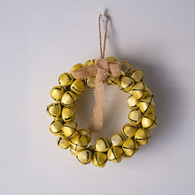 Load image into Gallery viewer, Christmas Jingle Bells Wreath by Allthingscurated comes in 3 semi-matte colors of Red, Multi Colors and Gold. The Multi Color Wreath features clusters of bell in green, red, ivory and brown. Each wreath is formed of bells made of iron entwined onto a jute rope and truly jingle with each movement. Measures approximately 18cm or 7 inches in width and height. This is a Gold Wreath.