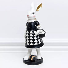 Load image into Gallery viewer, Our Regal Rabbit Family Figurines by Allthingscurated are beautifully-crafted and decorative. Made high-quality resin, these unique figurines will add a touch of elegance and whimsy to your home décor. Available in 6 designs, they are the perfect additions to your spring and Easter decorations. Featured here is Missy Rabbit.