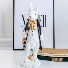 Load image into Gallery viewer, Our Regal Rabbit Family Figurines by Allthingscurated are beautifully-crafted and decorative. Made high-quality resin, these unique figurines will add a touch of elegance and whimsy to your home décor. Available in 6 designs, they are the perfect additions to your spring and Easter decorations. Featured here is Mr Rabbit.