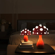 Load image into Gallery viewer, Whimsical Mushroom LED Lamp by Allthingscurated is unique and decorative, yet functional. The enchanting design features a playful mushroom silhouette, complete with red-capped spots lampshade to bring a touch of whimsy to any room. It makes a perfect gift for someone with a special affinity for mushrooms. Comes in a cordless and corded version with 2 lamp base colors.