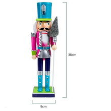 Load image into Gallery viewer, Neon Costume Nutcracker Soldiers by Allthingscurated. These Nutcracker figures sport a psychedelic look with electric shades of Neon Blue, Green and Pink which is a daring and bold twist from the usual classic-style Nutcracker design. Their eye-catching colors and design will create a show-stopping look for your Christmas decor, making it truly unforgettable. Featured here is the Neon Pink Soldier measuring 38cm or 14.8 inches in height and 9cm or 3.5 inches in width.