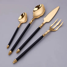 Load image into Gallery viewer, Neptune 4-piece Colored Handle Luxury Flatware Set by Allthingscurated beautifully blends mythical design with modern construction. Made from high-quality 18/10 stainless steel with a sleek mirror polishing for a modern look. Inspired by Poseidon’s Trident, the dinner fork is expertly shaped to resemble the 3-pronged spear. The set consists of a dinner spoon, dinner fork, dinner knife and a small spoon. Featured here is gold with black handle set.