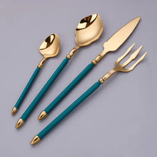 Load image into Gallery viewer, Neptune 4-piece Colored Handle Luxury Flatware Set by Allthingscurated beautifully blends mythical design with modern construction. Made from high-quality 18/10 stainless steel with a sleek mirror polishing for a modern look. Inspired by Poseidon’s Trident, the dinner fork is expertly shaped to resemble the 3-pronged spear. The set consists of a dinner spoon, dinner fork, dinner knife and a small spoon. Featured here is gold with green handle set.