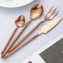 Load image into Gallery viewer, Neptune 4-piece Flatware Set by Allthingscurated beautifully blends mythical design with modern construction. Made from high-quality 18/10 stainless steel with a sleek mirror polishing for a modern look. Inspired by Poseidon’s Trident, the dinner fork is expertly shaped to resemble the 3-pronged spear. Unique and elegant, the place setting comes in silver, gold, rose gold, black and colorful rainbow and each set consists of a dinner spoon, dinner fork, dinner knife and a small spoon.